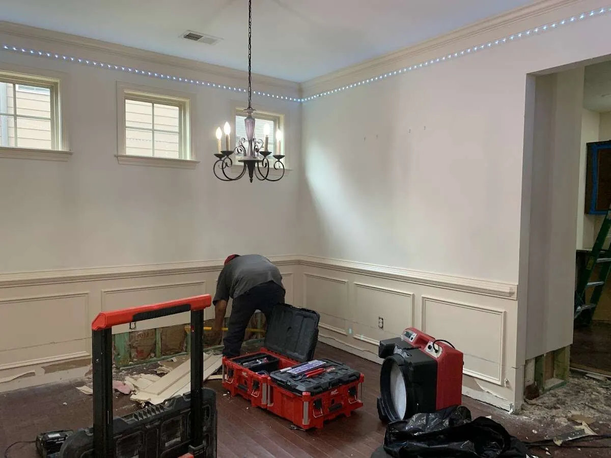 Restoration technician with professional equipment in Creedmoor